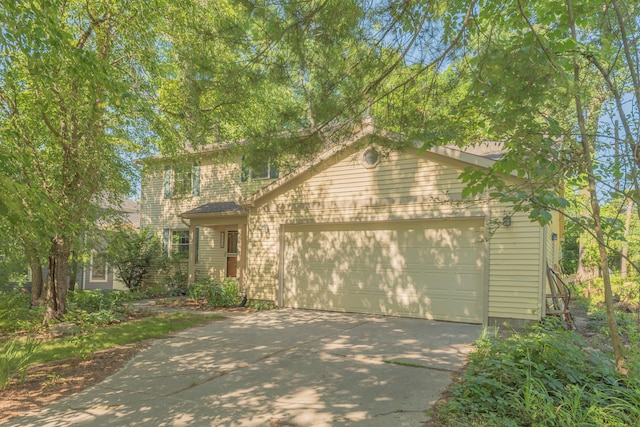 2728 Kimberley Rd, Ann Arbor, MI 48104 - view of front of house with concrete driveway and an attached garage