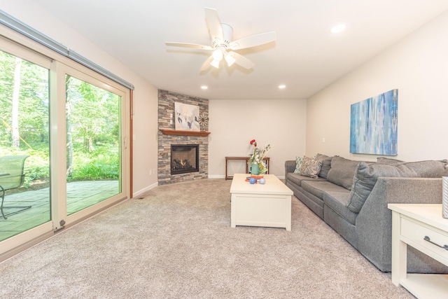 2728 Kimberley Rd, Ann Arbor, MI 48104 - living room with light colored carpet, a ceiling fan, recessed lighting, and a stone fireplace