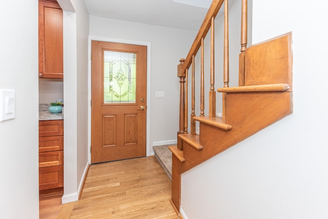 2728 Kimberley Rd, Ann Arbor, MI 48104 - entrance foyer with light wood-style flooring and stairway