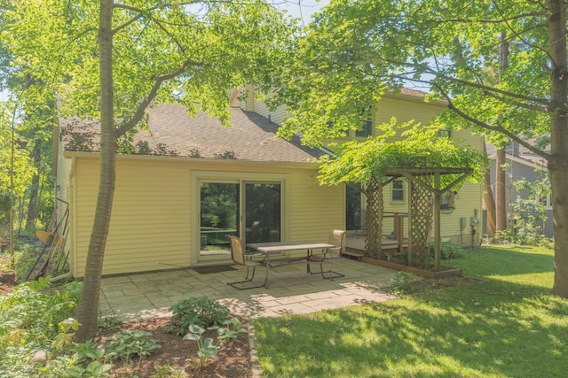 2728 Kimberley Rd, Ann Arbor, MI 48104 - back of property with a lawn, a patio, and a shingled roof