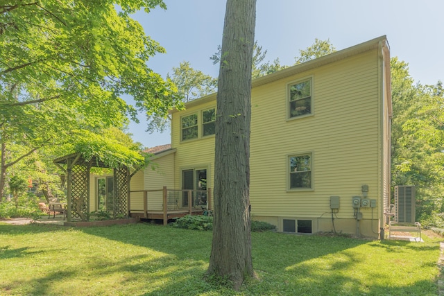 2728 Kimberley Rd, Ann Arbor, MI 48104 - back of property featuring a lawn and a wooden deck