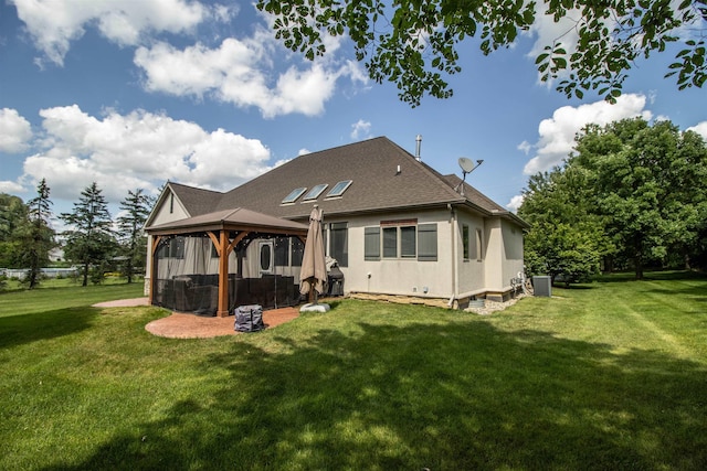 7380 Vassar Rd, Grand Blanc, MI 48439 - back of property with a gazebo, a yard, roof with shingles, and stucco siding