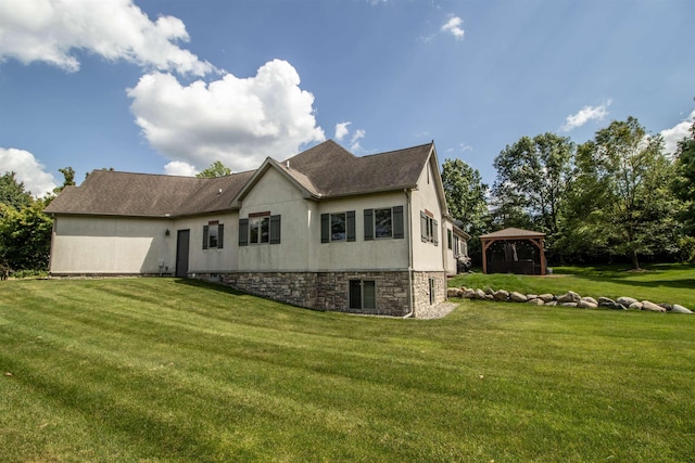 7380 Vassar Rd, Grand Blanc, MI 48439 - view of property exterior featuring a gazebo, a yard, and roof with shingles