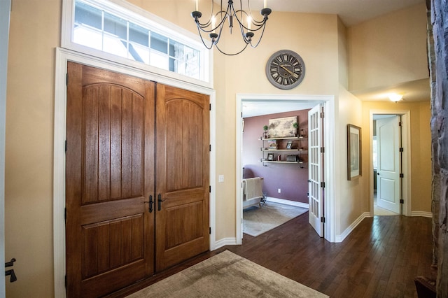 7380 Vassar Rd, Grand Blanc, MI 48439 - entrance foyer with a chandelier, dark wood-type flooring, and a towering ceiling