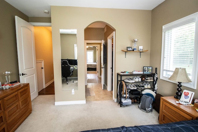 7380 Vassar Rd, Grand Blanc, MI 48439 - carpeted bedroom featuring arched walkways and a desk