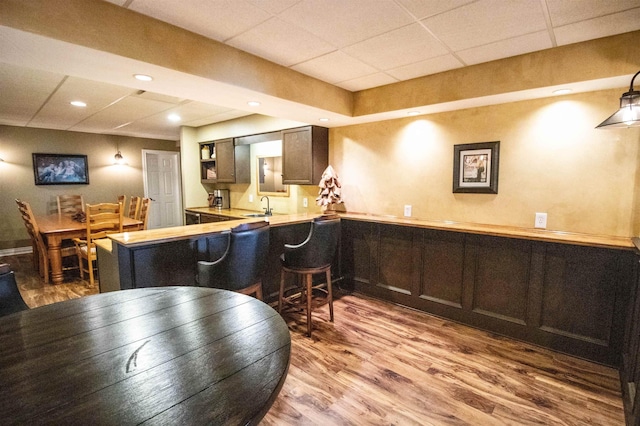 7380 Vassar Rd, Grand Blanc, MI 48439 - bar featuring a drop ceiling and wood finished floors