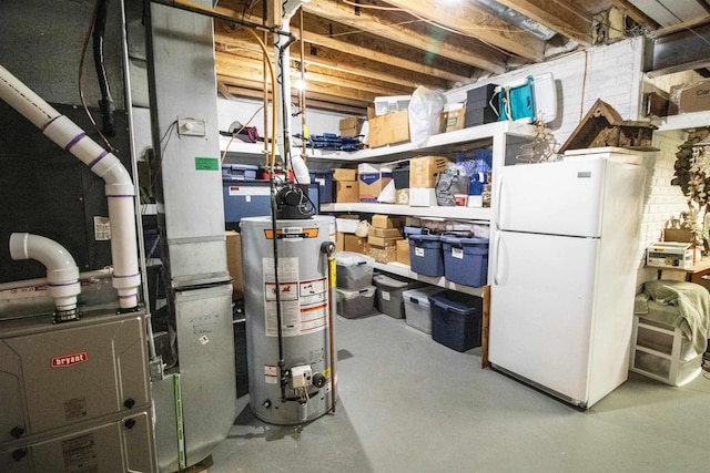7380 Vassar Rd, Grand Blanc, MI 48439 - unfinished below grade area featuring freestanding refrigerator, gas water heater, and heating unit