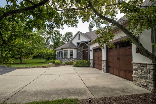 7380 Vassar Rd, Grand Blanc, MI 48439 - view of front facade featuring driveway, stone siding, an attached garage, and stucco siding