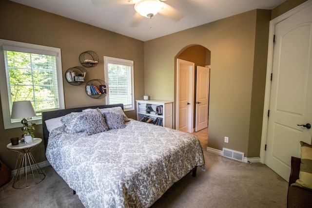 7380 Vassar Rd, Grand Blanc, MI 48439 - carpeted bedroom with arched walkways and ceiling fan