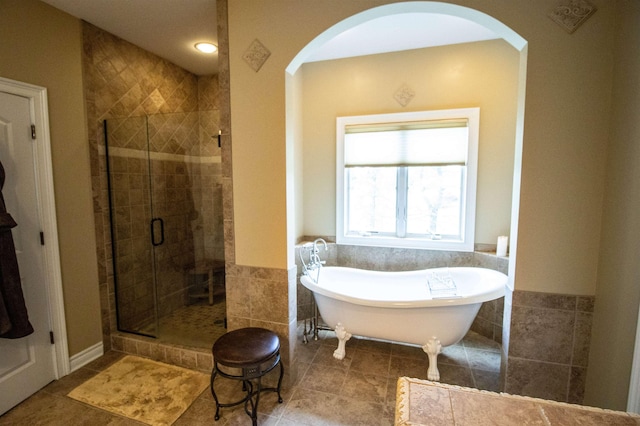 7380 Vassar Rd, Grand Blanc, MI 48439 - full bathroom featuring a shower stall, a freestanding tub, tile patterned floors, and tile walls