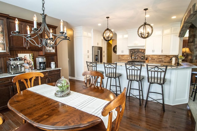 7380 Vassar Rd, Grand Blanc, MI 48439 - dining area with a chandelier, dark wood-type flooring, and recessed lighting