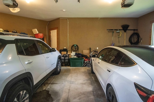7380 Vassar Rd, Grand Blanc, MI 48439 - garage featuring a garage door opener