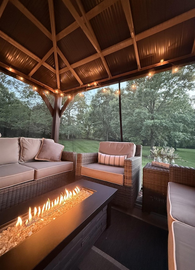 7380 Vassar Rd, Grand Blanc, MI 48439 - wooden terrace with an outdoor living space with a fire pit, a gazebo, and view of wooded area