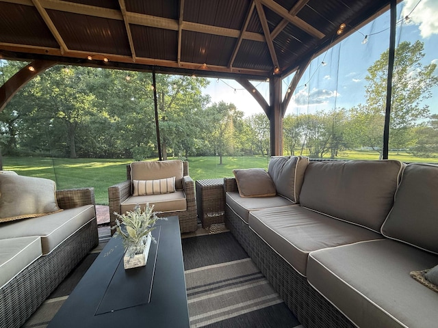 7380 Vassar Rd, Grand Blanc, MI 48439 - sunroom / solarium with outdoor lounge area, view of scattered trees, and healthy amount of natural light