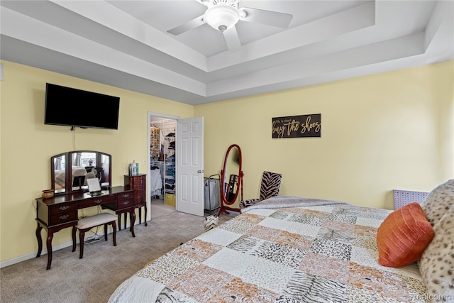 838 Star Dr, Davison, MI 48423 - carpeted bedroom featuring a raised ceiling, a walk in closet, ceiling fan, and a closet