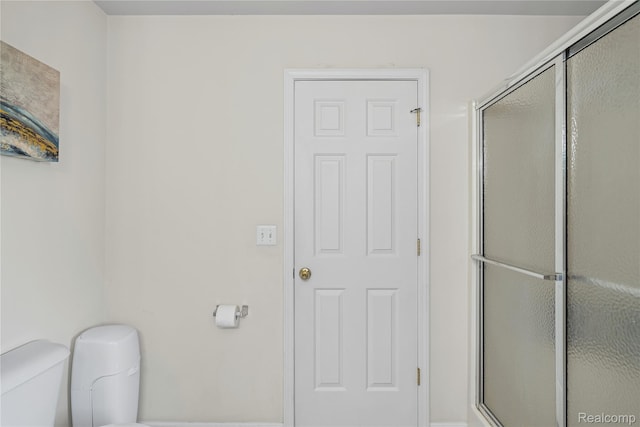 838 Star Dr, Davison, MI 48423 - bathroom featuring toilet and a shower stall