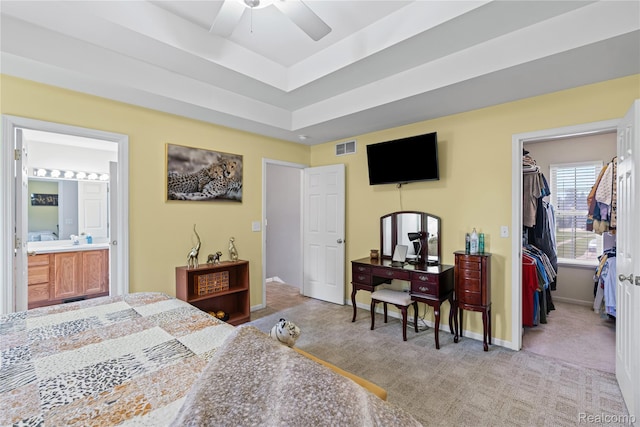 838 Star Dr, Davison, MI 48423 - bedroom with carpet floors, a walk in closet, a closet, a tray ceiling, and connected bathroom