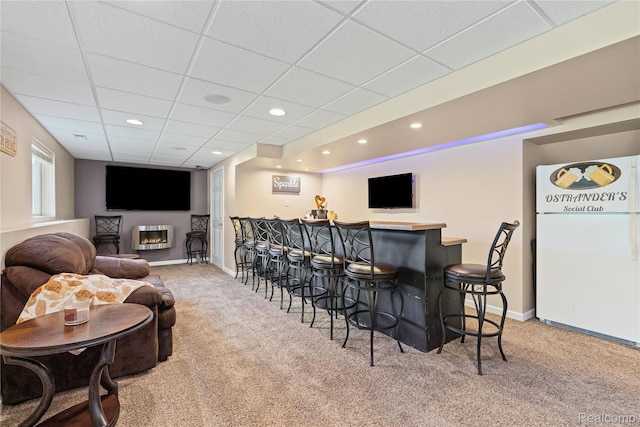 838 Star Dr, Davison, MI 48423 - carpeted cinema with a bar, a paneled ceiling, a glass covered fireplace, and recessed lighting