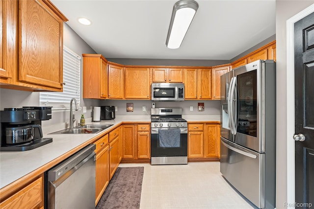 838 Star Dr, Davison, MI 48423 - kitchen with stainless steel appliances, light countertops, recessed lighting, light floors, and brown cabinets