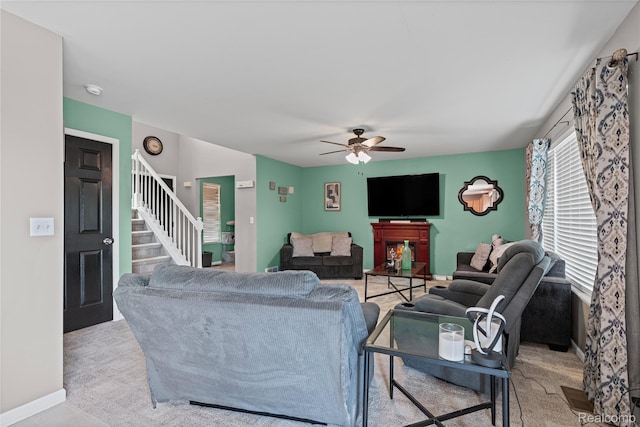 838 Star Dr, Davison, MI 48423 - living area with stairs, a ceiling fan, and carpet flooring