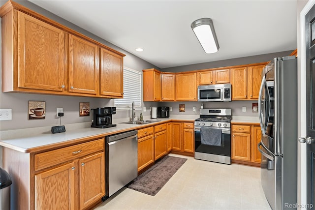 838 Star Dr, Davison, MI 48423 - kitchen featuring stainless steel appliances, light countertops, recessed lighting, and brown cabinetry