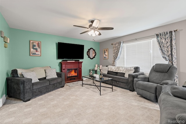 838 Star Dr, Davison, MI 48423 - living room featuring a ceiling fan, carpet, and a lit fireplace