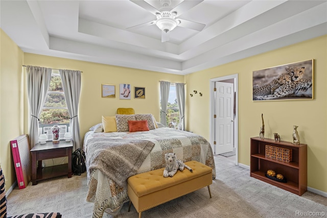 838 Star Dr, Davison, MI 48423 - bedroom featuring a tray ceiling, light colored carpet, and a ceiling fan