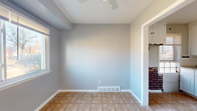 12660 Duchess St, Detroit, MI 48224 - unfurnished dining area with plenty of natural light and a ceiling fan