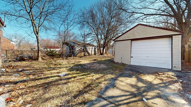 12660 Duchess St, Detroit, MI 48224 - detached garage with asphalt driveway