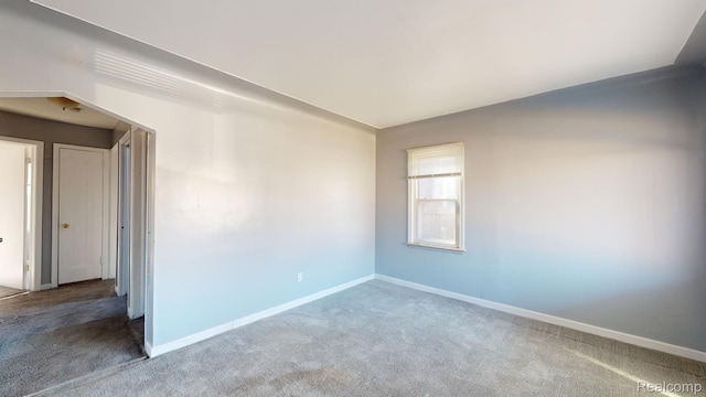 12660 Duchess St, Detroit, MI 48224 - carpeted empty room featuring baseboards