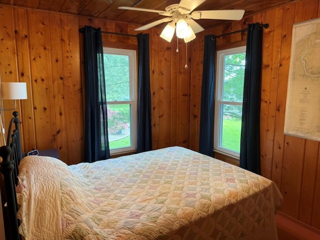 14450 Park Dr, Mecosta, MI 49332 - bedroom with wood walls, wooden ceiling, and ceiling fan