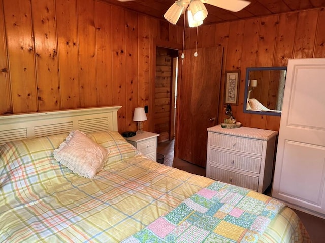 14450 Park Dr, Mecosta, MI 49332 - bedroom featuring wooden walls and a ceiling fan
