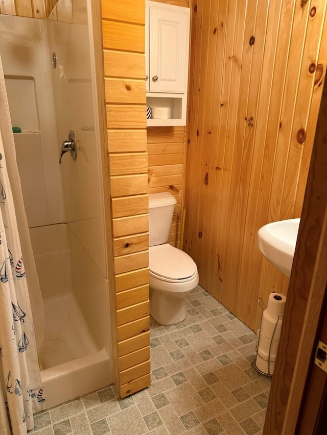 14450 Park Dr, Mecosta, MI 49332 - bathroom with wood walls and a stall shower