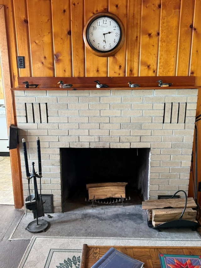 14450 Park Dr, Mecosta, MI 49332 - detailed view of a brick fireplace and wood finished floors