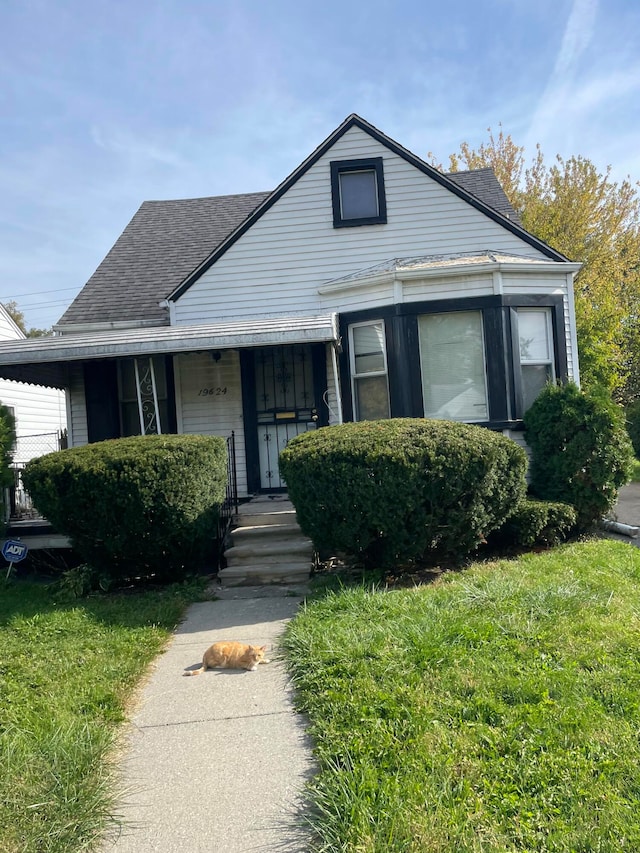 19624 Anglin St, Detroit, MI 48234 - bungalow-style house with a front lawn and roof with shingles