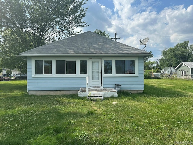 3363 Parkwood Ave, Monroe, MI 48162 - rear view of property with a yard and roof with shingles