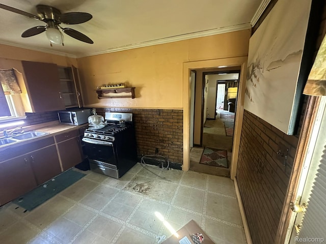 3363 Parkwood Ave, Monroe, MI 48162 - kitchen with appliances with stainless steel finishes, a wainscoted wall, crown molding, a ceiling fan, and light floors