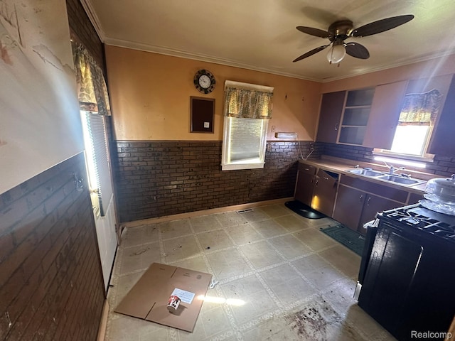 3363 Parkwood Ave, Monroe, MI 48162 - kitchen featuring gas stove, light flooring, a wainscoted wall, a ceiling fan, and ornamental molding