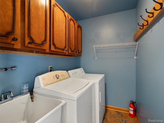 32721 Stoneybrook Ln, Macomb, MI 48026 - laundry area featuring cabinet space, washing machine and clothes dryer, and stone finish floors