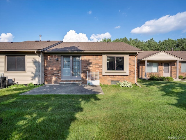 32721 Stoneybrook Ln, Macomb, MI 48026 - rear view of property with a patio, a yard, brick siding, and a shingled roof