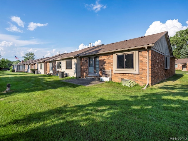 32721 Stoneybrook Ln, Macomb, MI 48026 - back of property featuring brick siding and a yard