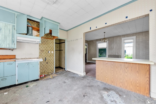 107 W Duncan St, Manchester, MI 48158 - kitchen featuring blue cabinetry, concrete flooring, and open shelves