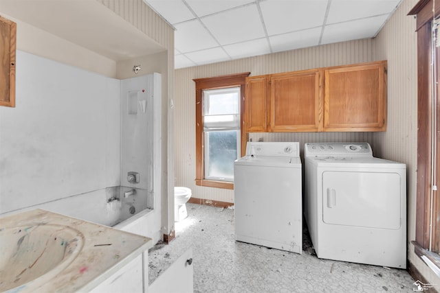 107 W Duncan St, Manchester, MI 48158 - washroom with wallpapered walls, washing machine and clothes dryer, and cabinet space