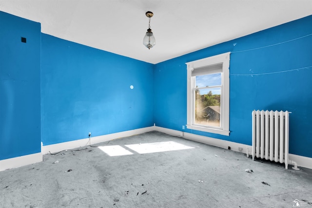 107 W Duncan St, Manchester, MI 48158 - carpeted spare room with radiator heating unit and baseboards