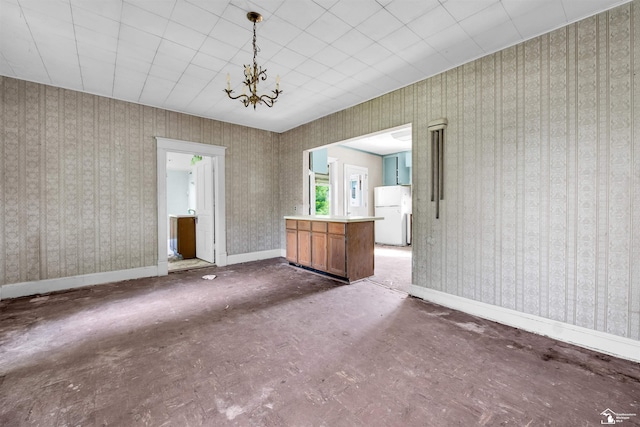 107 W Duncan St, Manchester, MI 48158 - unfurnished living room featuring a chandelier and wallpapered walls