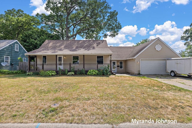 602 Elsa St, North Muskegon, MI 49445 - view of front of property with covered porch, a garage, a front yard, driveway, and roof with shingles