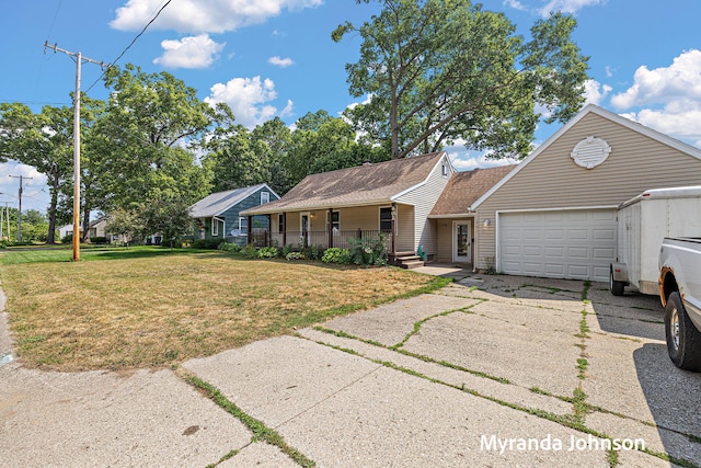 602 Elsa St, North Muskegon, MI 49445 - single story home featuring covered porch, an attached garage, a front yard, and driveway