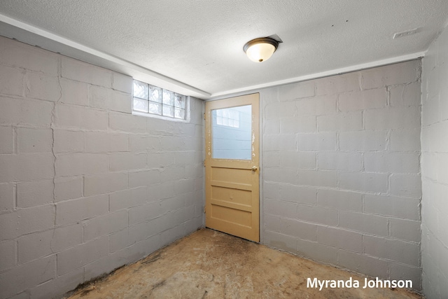 602 Elsa St, North Muskegon, MI 49445 - basement with a textured ceiling