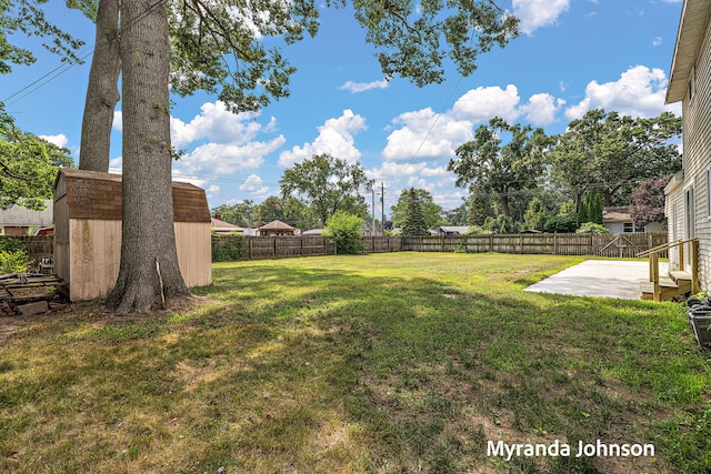 602 Elsa St, North Muskegon, MI 49445 - fenced backyard with a patio area and a shed