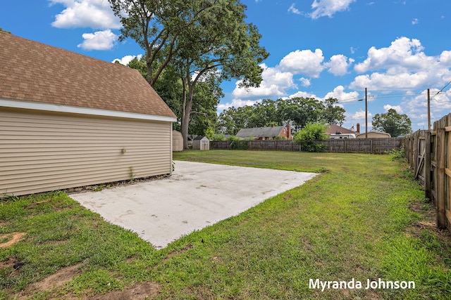 602 Elsa St, North Muskegon, MI 49445 - fenced backyard with a patio and a storage shed
